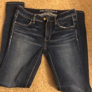 skinny super stretch american eagle blue jeans